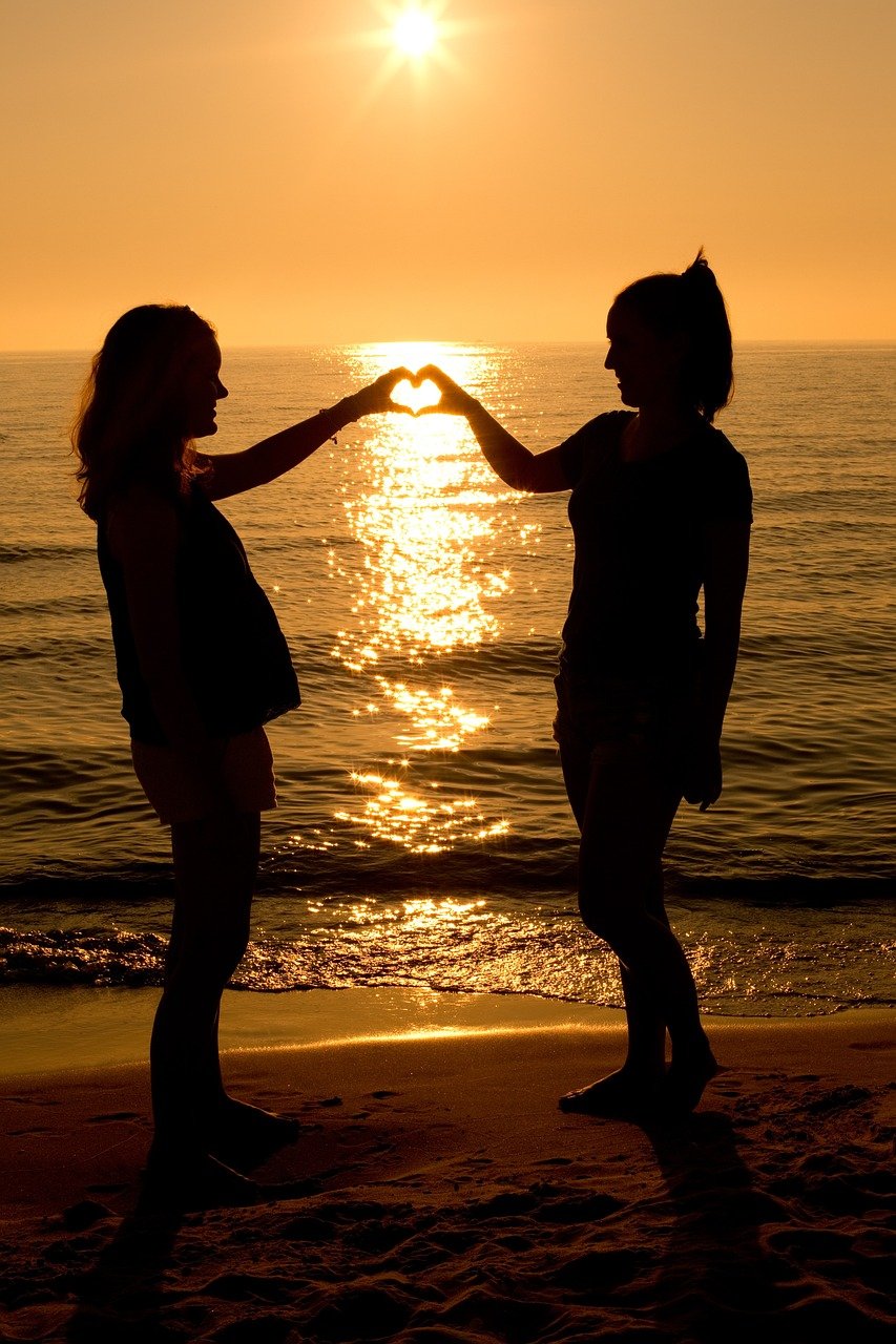 sunset, heart, two women